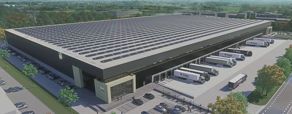 Aerial view of the Delin warehouse with several trucks parked at loading docks.
